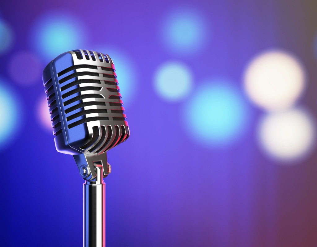 A microphone with a blue backdrop